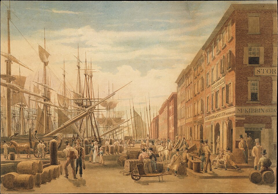 A painting of South Street in New York City around 1827, showing a busy waterfront with ships, merchants, and horse-drawn carts